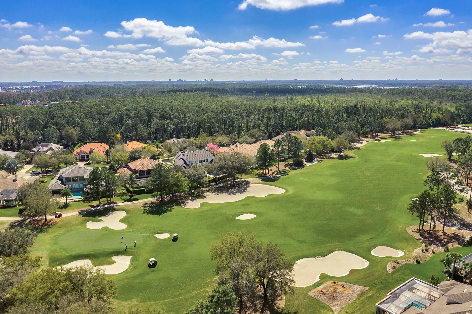 Aerial view of golf course fairways and homes at Keene’s Pointe